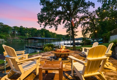 Settle in around the fire pit with plenty of Adirondack seating and beautiful lake views creating an easy spot to relax and enjoy the outdoors together.