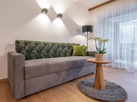 Furniture, Interior Design, Wall, Flooring, Wood, Floor, Couch, Textile, Living Room, Room