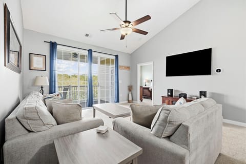 Settle into the plush sofa after a day in the sun or step out through the glass doors for fresh air.