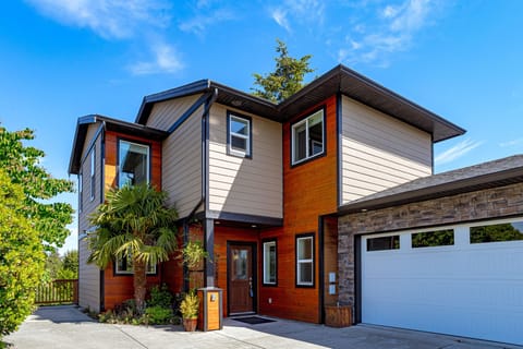 Welcome home to The Cornerstone, featuring an attached single-car garage and a wide front driveway in a peaceful Langford setting.