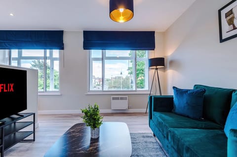 Spacious living room with comfortable seating and inviting atmosphere, perfect for relaxing or socialising during your stay.