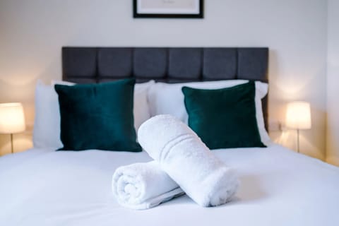 A cosy bedroom featuring a comfortable double bed, perfect for restful nights and relaxing stays.