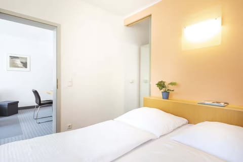 Drift off comfortably with warm lighting and tidy, modern finishes.