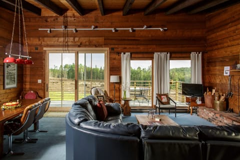 Beautiful cathedral ceiling living room. Large couch, fireplace non-operational.