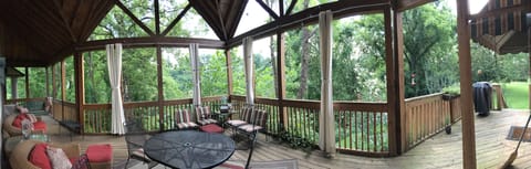 The covered back porch is one of the favorites places to be. Seats 15. Gas grill