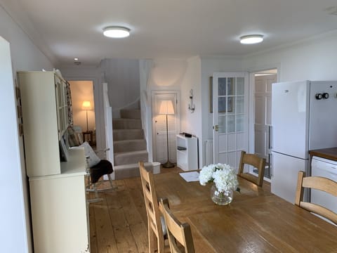 Kitchen leading to living room and upstairs bedrooms