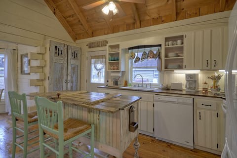 Plenty of cups, coffee mugs, wine glasses enough to serve 8 people