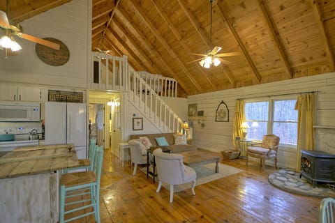 View of living room with stairs leading to 3rd loft bedroom