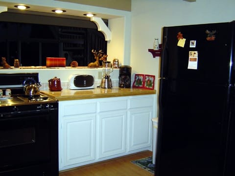 Upgraded kitchen with granite counters.