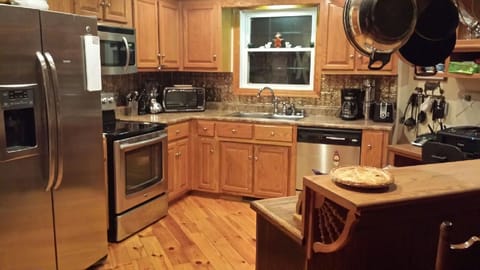 Gourmet kitchen is fully stocked with every utensil and gadget needed! 