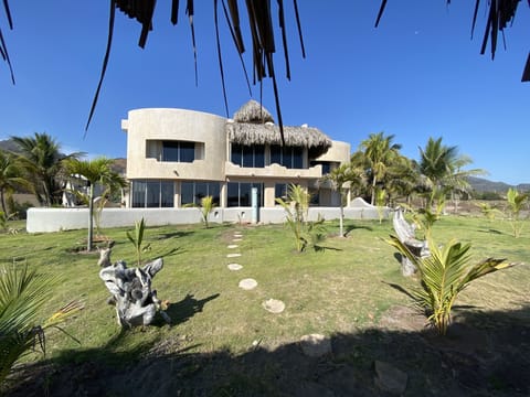 Castillo de Arena from the private beach front palapa and hammocks.