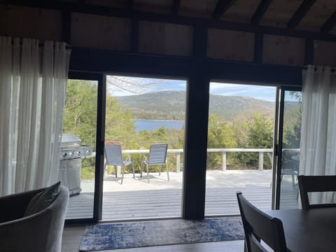Huge double sliding doors to deck and  views of the ocean and mountains