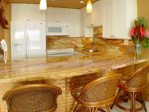 A clean kitchen with all the amenities you need