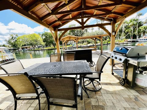 gazebo with grill and outdoor dining table