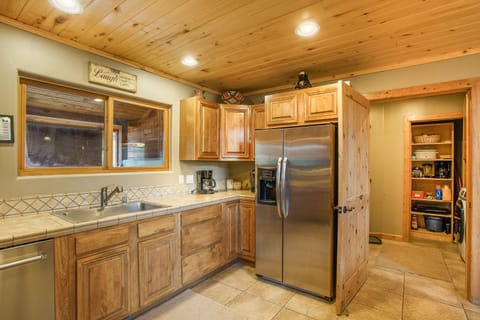Just off the expansive kitchen is the laundry room and garage access
