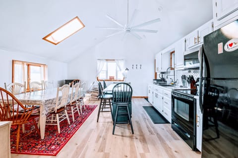Enjoy the fully stocked bright & airy kitchen w/ seating for 11 plus high chair!