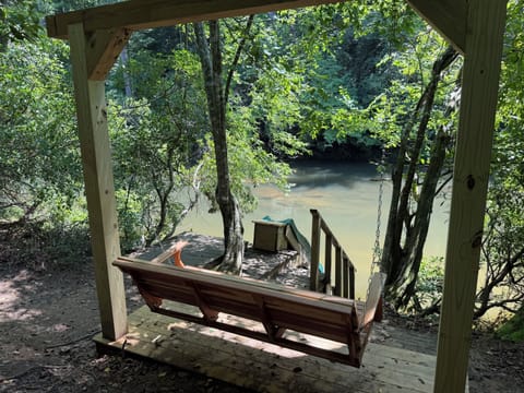Swing by river and slide area 