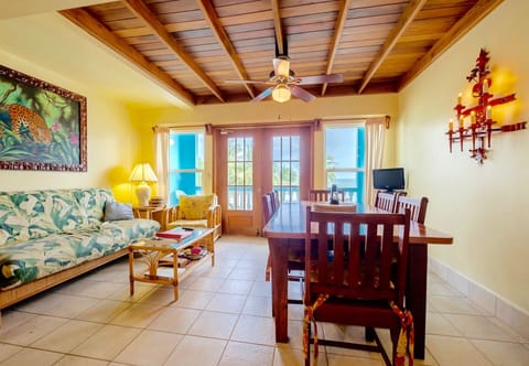 Living/dining area (with queen sleeper sofa) & veranda beyond