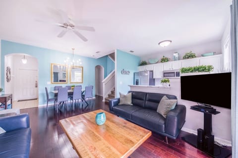 Comfortable, modern, leather furniture. Hardwood floors.