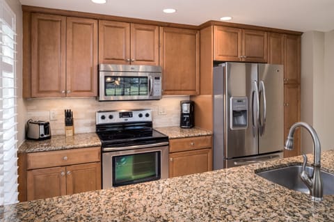 Gourmet kitchen with granite counter tops and stainless steel appliances