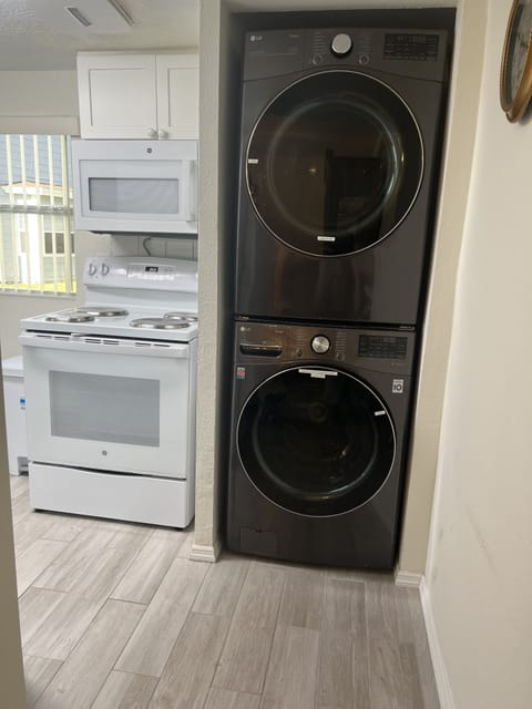 Kitchen from dining.  Full size washing machine and dryer