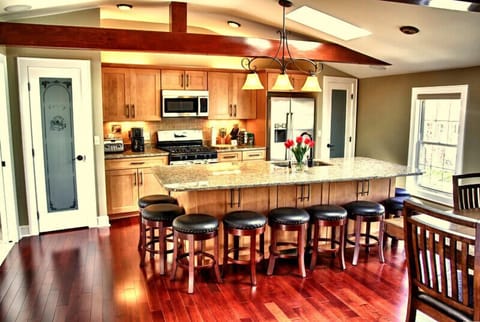 Large gourmet kitchen w/ island that seats 10 and another 8 at the dining table