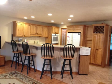 View of bar and kitchen from great room.