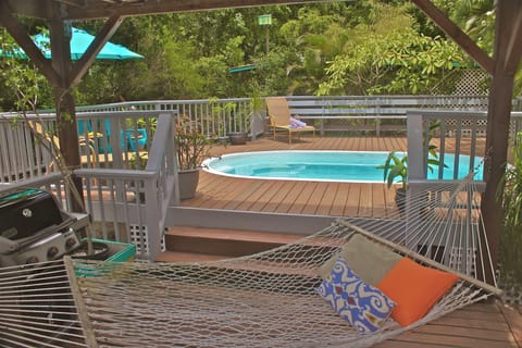 Hammocks Stretched Poolside in the shade, lounge chairs in the sun...