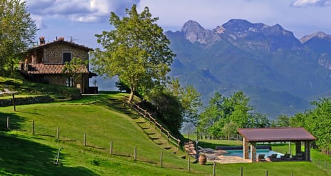 The Villa, the pool and the view on the Apuan Alps.