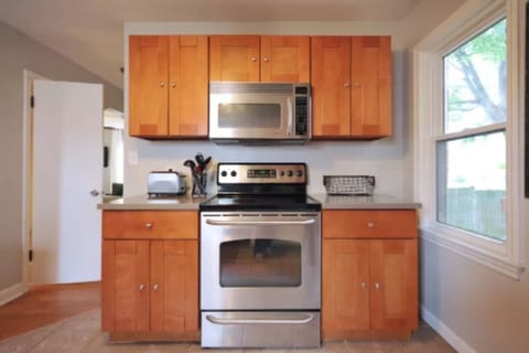 It includes a gas stove, microwave, fridge, coffee maker, etc.