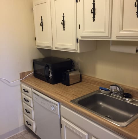 Fully equipped kitchen includes pots, pans, coffee maker, blender etc