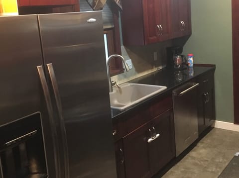 Oversized refrigerator, double sink, and new dishwasher. 
