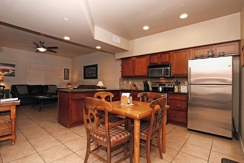 Kitchen with Stainless steel Appliances and and Table for 4