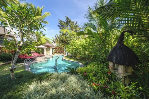 Outdoor Pool Surrounded by Sun Loungers