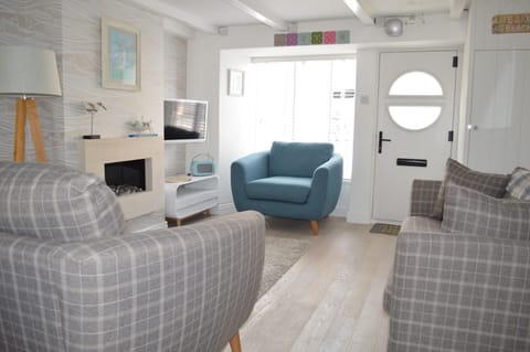 Lounge with large bay window, open fire, freeview smart TV and DAB radio