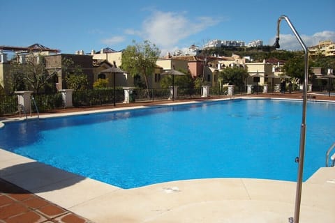 Main swimming pool directly behind apartment