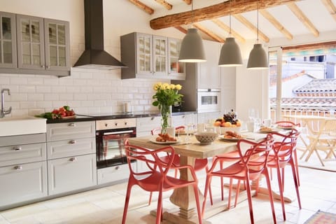 Spacious and sunny kitchen with direct access to large terrace.