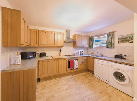 Fully equipped spacious Kitchen with dishwasher and washing machine.