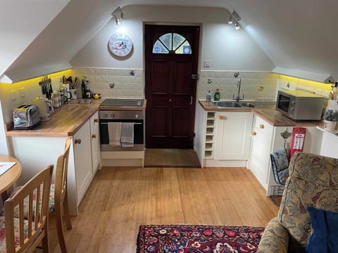 Entrance to the property and fully equipped kitchen. Coffee, tea, sugar provided