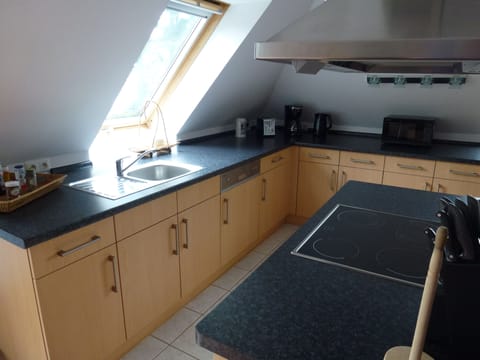 open kitchen with cooking stove, dishwasher and appliances