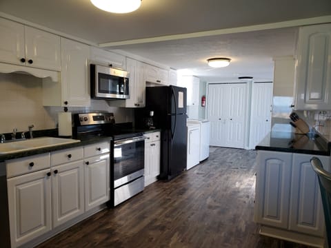 Modern kitchen. New stove, new dishwasher, new overhead microwave. New floors