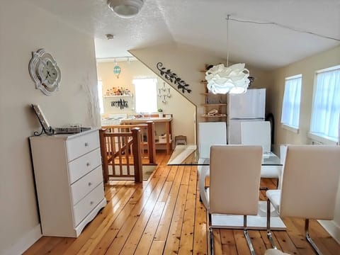 4 chairs around the table & 2 matching chairs can be added for additional guests