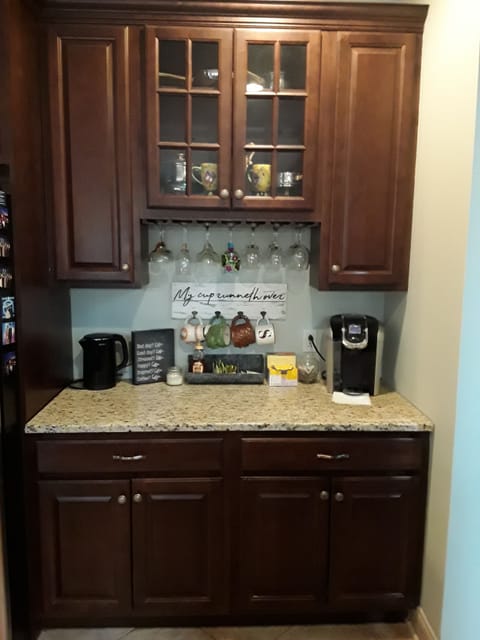 Coffee nook with a drip coffee maker, a Keurig and hot pot. Coffee, tea and coco