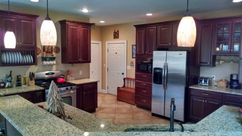 Spacious kitchen with lots of cooking supplies.