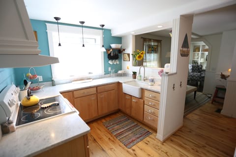 Marble counters, farmhouse sink, chefs toaster oven, stocked kitchen! 