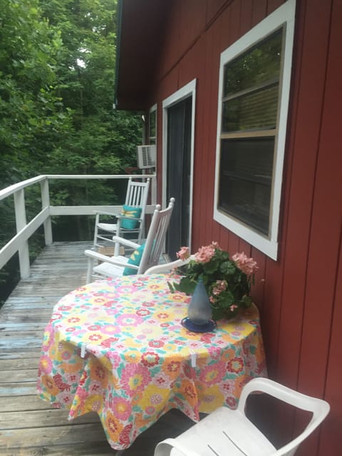 Charming deck with outdoor eating area and rockers!