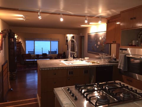 Modern kitchen with gas range, bamboo cabinets - and all of the fixings!