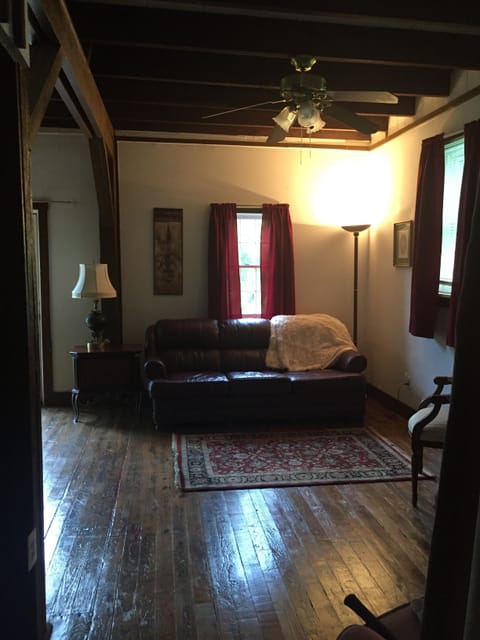 Living Room with wood floors and beamed ceiling