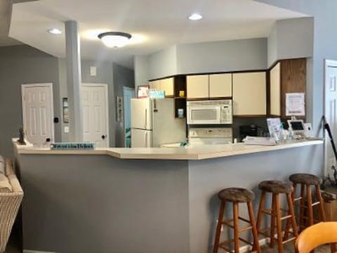 Kitchen and breakfast bar prior to updates -showing for layout.