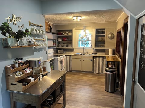 The sweet original 1930 kitchen opens now to the entryway